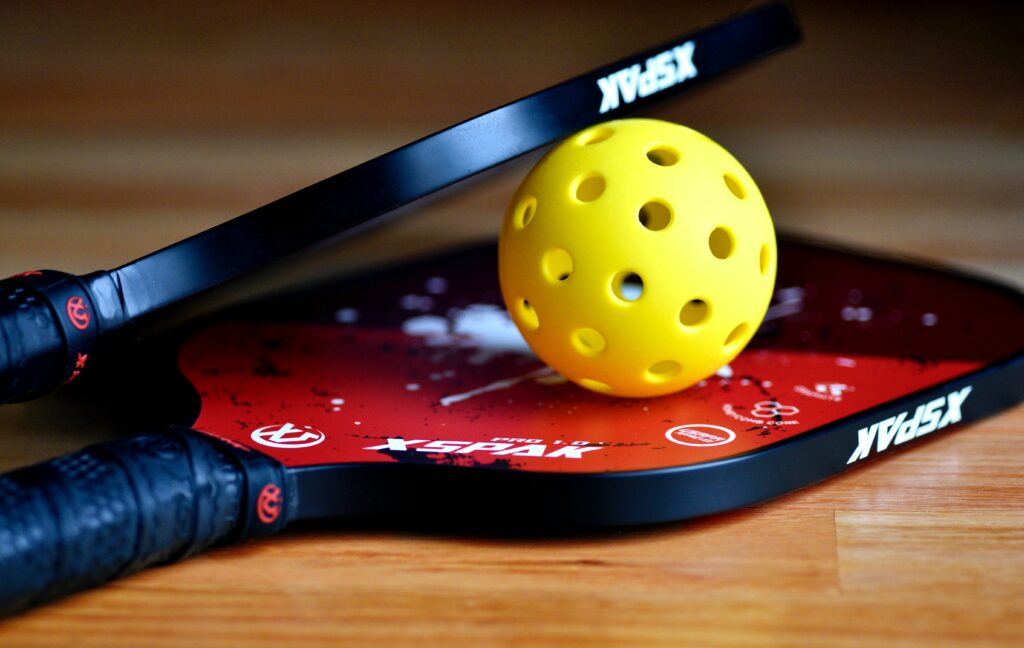 pickleball paddle and ball